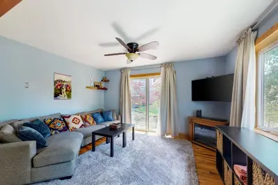 a living room with a couch and a ceiling fan at Mountains & Main Street in Frisco