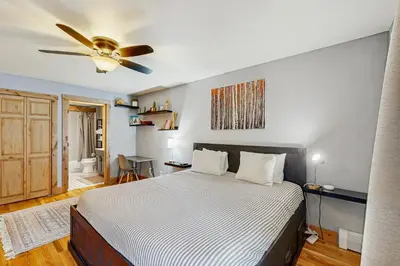 a bedroom with a bed and a ceiling fan at Mountains & Main Street in Frisco