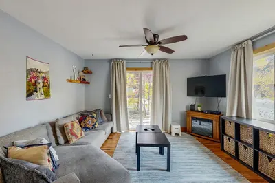 a living room with a couch and a ceiling fan at Mountains & Main Street in Frisco