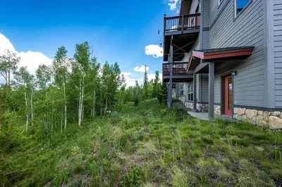 a house on a hill next to a forest at 97A Exceptional Views, 4 BR, Central Location in Silverthorne