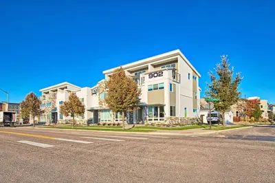 a large building on the corner of a street at Beautiful 3 Bedroom Townhouse in Old Town North, Brewery District in Fort Collins