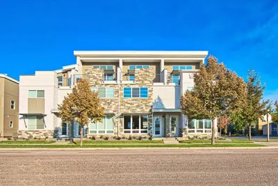 a large building with trees in front of it at Beautiful 3 Bedroom Townhouse in Old Town North, Brewery District in Fort Collins
