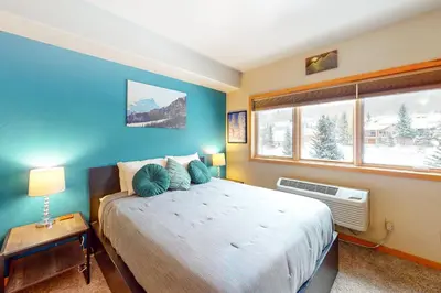 a bedroom with a large bed and a window at Gateway 5079 in Keystone
