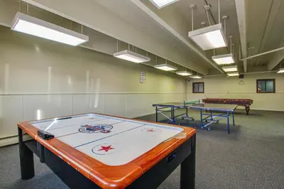 a large room with ping pong tables in it at Straight Creek Sanctuary in Dillon