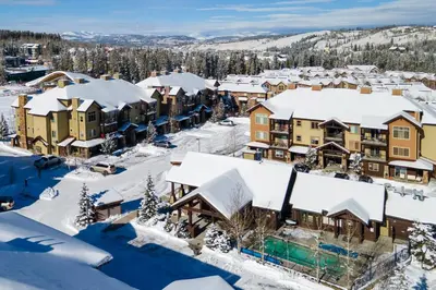 an aerial view of a town covered in snow at Trailhead Lodges Building 401 Unit 422 in Winter Park