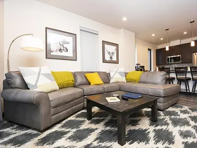 a living room with a couch and a table at Arrow at Winter Park Unit 284 in Winter Park