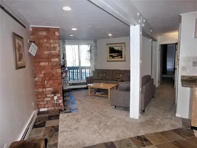 a living room with a couch and a table at Treehouse 2 bed 2 bath C THWC in Silverthorne