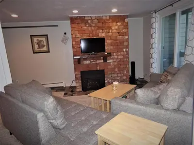 a living room with two couches and a fireplace at Treehouse 2 bed 2 bath C THWC in Silverthorne