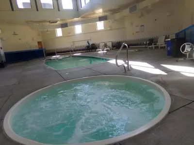 a bath tub in a room with a swimming pool at Treehouse 2 bed 2 bath C THWC in Silverthorne