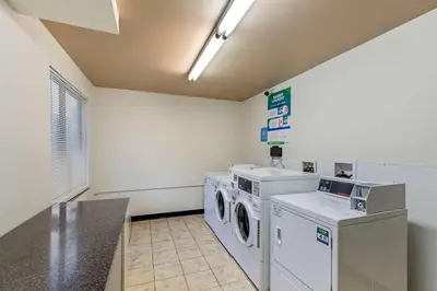 a laundry room with a washer and dryer at Sleep Inn Denver Tech Center in Greenwood Village