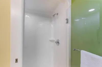 a shower with a glass door in a bathroom at Sleep Inn Denver Tech Center in Greenwood Village