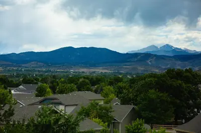 a view of mountains from a residential neighborhood with houses at The Oasis on Eisenhower in Loveland