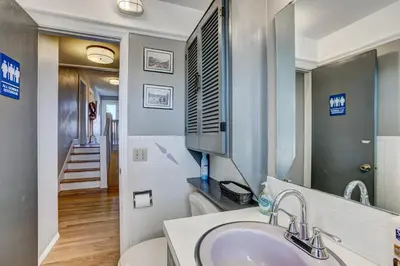 a bathroom with a sink and a mirror at The Oasis on Eisenhower in Loveland