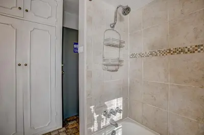 a bathroom with a shower with a shower head at The Oasis on Eisenhower in Loveland