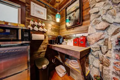 a kitchen with a counter and a stone wall at The Oasis on Eisenhower in Loveland