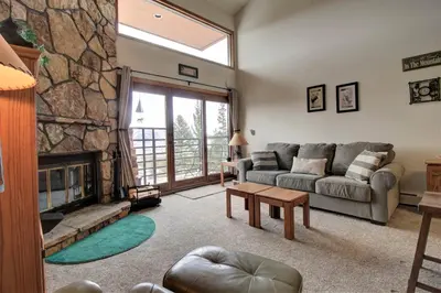 a living room with a couch and a fireplace at Dd402E Buffalo Village Studio Condo in Silverthorne
