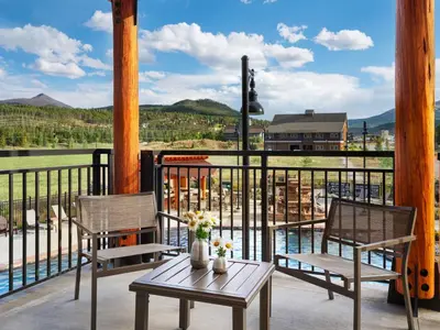 two chairs and a table on a balcony with a view at Hyatt Vacation Club at The Ranahan in Breckenridge