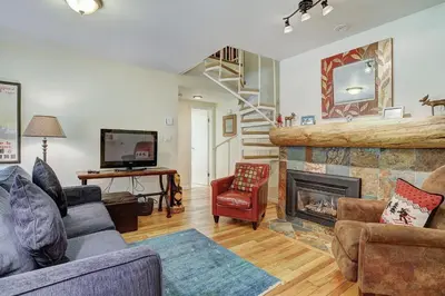 a living room with a couch and a fireplace at 1182 Flying Dutchman condo in Keystone
