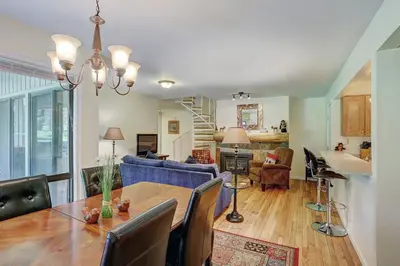 a dining room and living room with a table at 1182 Flying Dutchman condo in Keystone