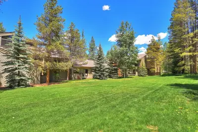 a large yard in front of a house at 1182 Flying Dutchman condo in Keystone