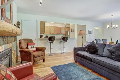 a living room with a couch and a chair at 1182 Flying Dutchman condo in Keystone