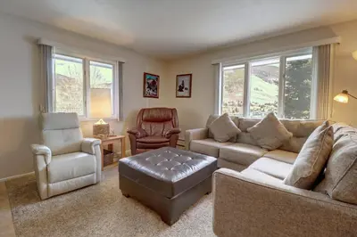 a living room with a couch and a chair at CC19 Chateau Claire condo in Dillon