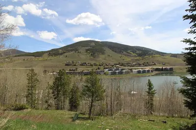 a lake with a town on top of a mountain at CC19 Chateau Claire condo in Dillon