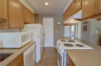 a kitchen with a stove and a microwave at CC19 Chateau Claire condo in Dillon