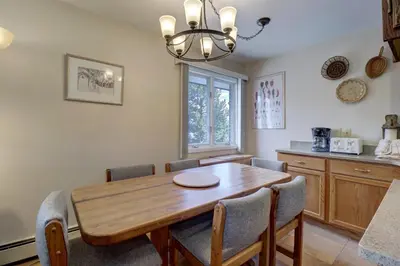 a dining room with a wooden table and chairs at CC19 Chateau Claire condo in Dillon