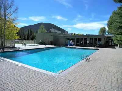 a swimming pool in front of a building at Edgewater Studio 1 Bath EWJP in Keystone