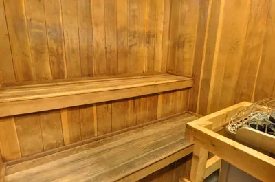 a wooden paneled sauna with a wooden bench in it at Buffalo Village in Silverthorne