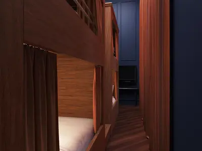 a small room with two beds with wooden walls at Gravity Haus Denver in Denver
