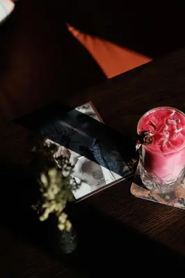 a drink in a glass on a wooden table at Gravity Haus Denver in Denver