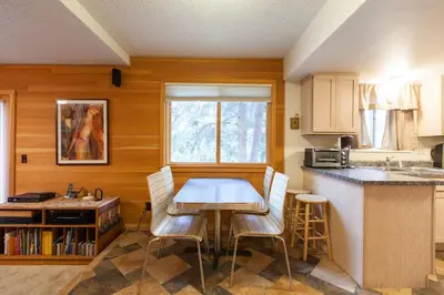a kitchen with a table and chairs in a room at Fantastic Classic Family Home in Boulder
