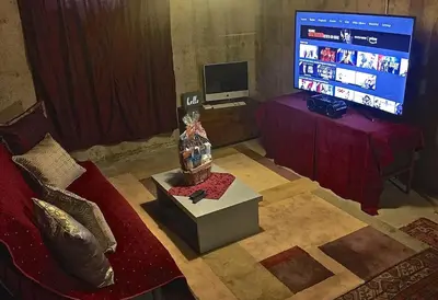 a living room with a couch and a flat screen tv at Fantastic Classic Family Home in Boulder
