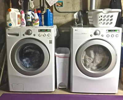 a washing machine and a washer sitting next to each other at Fantastic Classic Family Home in Boulder
