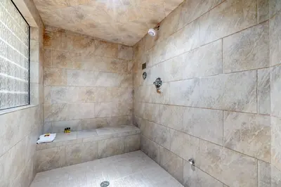 a bathroom with a shower with a tub at Best Western Plus Loveland Inn in Loveland