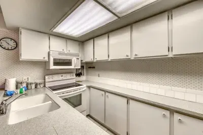 a kitchen with white cabinets and a skylight at Wild Irishman 1080 in Dillon