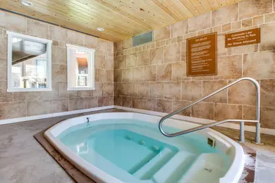 a jacuzzi tub in a room with a sign at Wild Irishman 1080 in Dillon