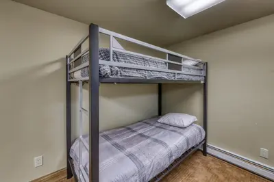 a bedroom with two bunk beds in a room at 615 Oro Grande in Dillon