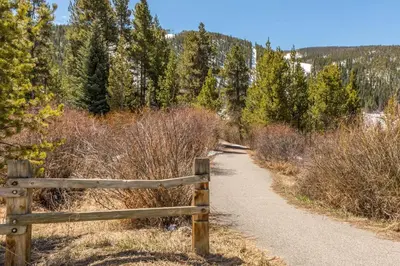 a wooden fence on a trail in the woods at 615 Oro Grande in Dillon