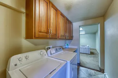 a laundry room with a white washer in a room at 615 Oro Grande in Dillon