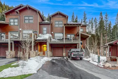 a house with a truck parked in front of it at Keystone Townhome in Keystone