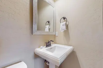 a bathroom with a white sink and a mirror at Keystone Townhome in Keystone