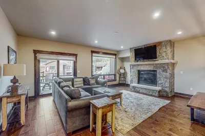 a living room with a couch and a fireplace at Keystone Townhome in Keystone