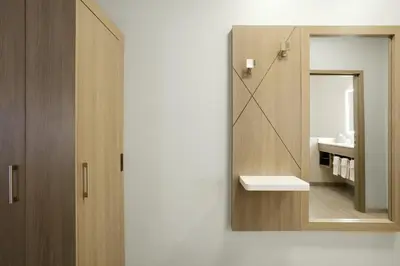 a bathroom with a mirror and a sink at Holiday Inn Express Denver Central - North in Denver