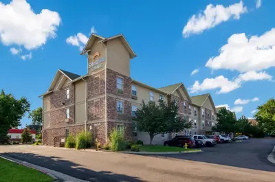 a building with a tower on top of it at Suburban Studios Denver Central-Arvada in Arvada