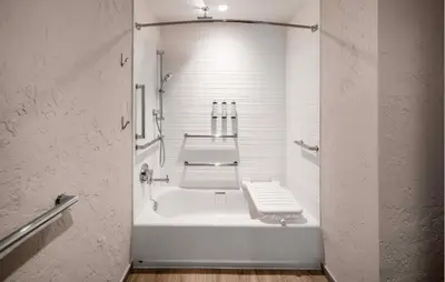 a bathroom with a white toilet and a sink at AC Hotel Frisco Colorado in Frisco
