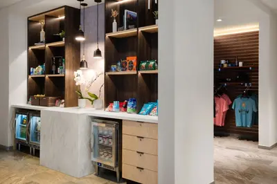 a dressing room with a refrigerator and shelves at AC Hotel Frisco Colorado in Frisco