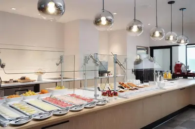 a buffet line with many different types of food at AC Hotel Frisco Colorado in Frisco